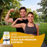 Thumbnail for Mann und Frau posieren mit erhobenen Armen im Park, daneben Dose Alka Slm Premium und Schriftzug