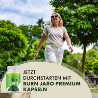 Thumbnail for Burn Jaro Premium neben gehender Frau im Park mit sichtbarem Werbetext zum Produkt