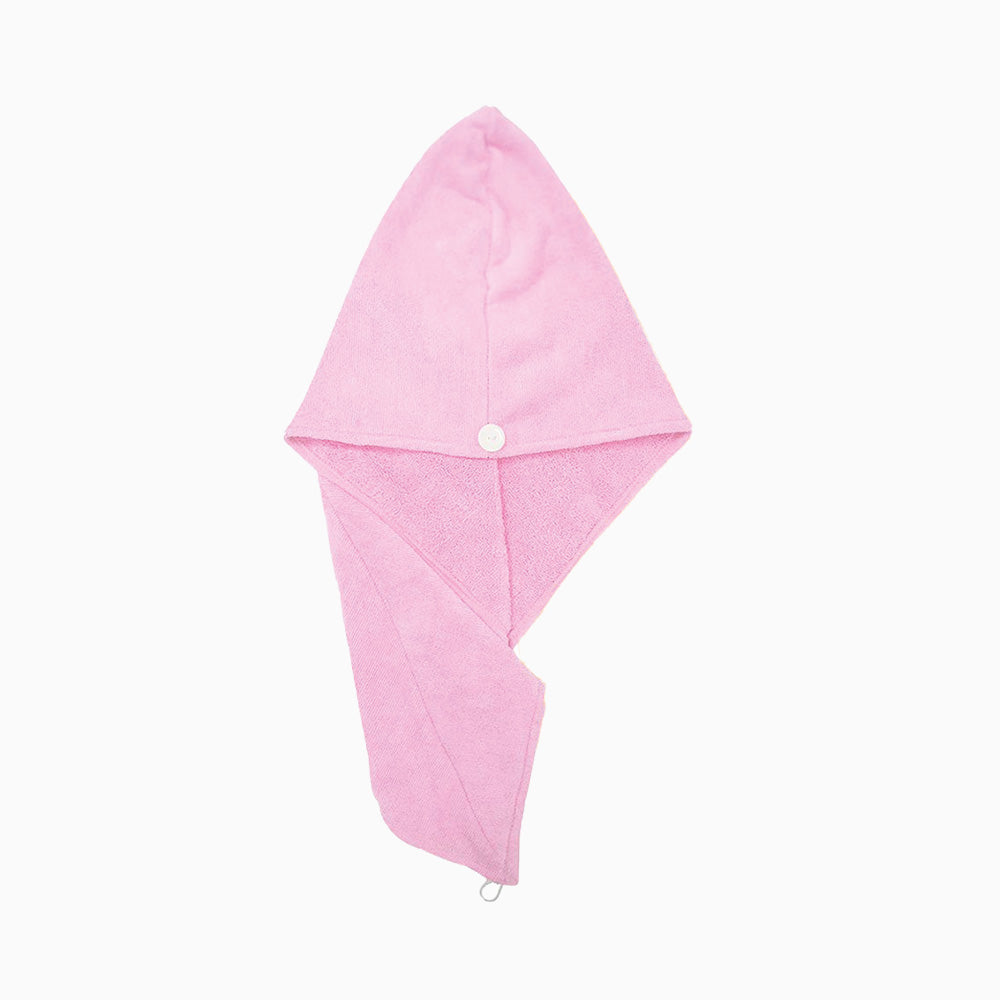 Rosa Handtuch in turbanartiger Form mit mittigem Knopf und Schlaufe am unteren Ende