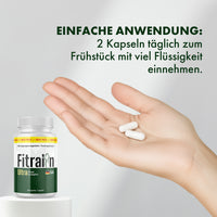 Thumbnail for Hand mit zwei weißen Kapseln neben Fitralin Ultra Plant Komplex Dose und Anwendungshinweis