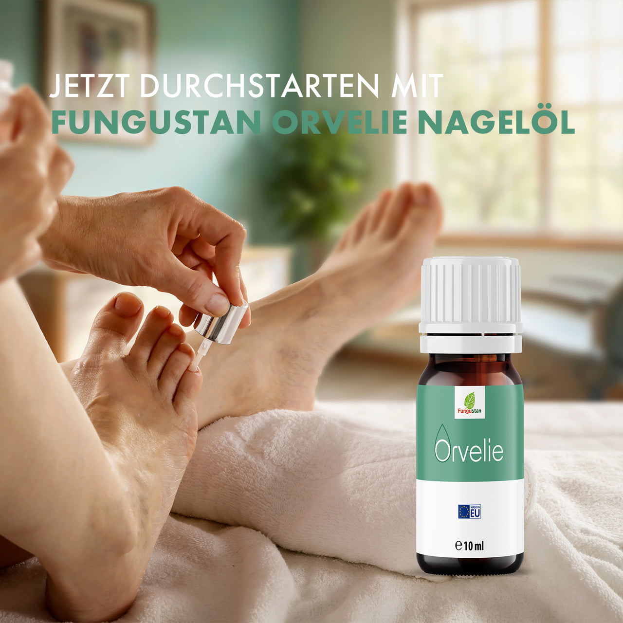 Person trägt Nagelöl auf Fußnagel auf neben Fungustan Orvelie Flasche mit 10 ml
