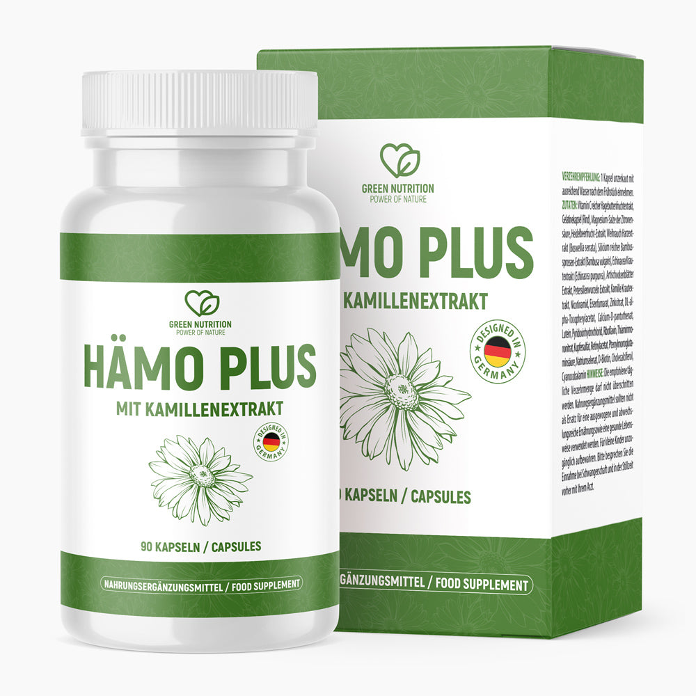 Weiße Dose HÄMO PLUS mit Kamillenzeichnung und Kapselanzahl vor grün-weißem Umkarton