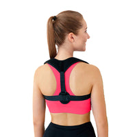 Thumbnail for  Rückenansicht einer Frau mit schwarzem Haltungsgurt über pinkem Sporttop und schwarzer Hose