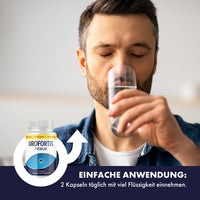 Thumbnail for Mann trinkt Wasser aus einem Glas, dazu Uro Fortis Premium Dose mit Hinweis: 2 Kapseln täglich