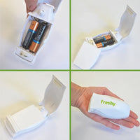 Thumbnail for Vier Ansichten eines weißen Geräts mit Batteriefach, geöffnet und geschlossen, mit Schriftzug Freshy